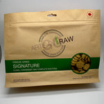 Artisan Raw Signature freeze-dried dog food bag, 770 g size, kraft packaging with a green label, showing round freeze-dried pucks visible through a circular window.